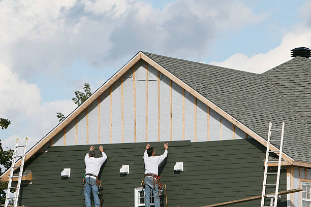 Professional Siding Installation technician working in Pine Level, NC